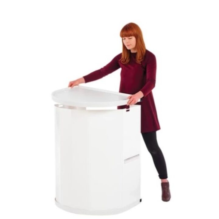 Lady adding the white counter top to the Rapdio promotional display counter..jpg