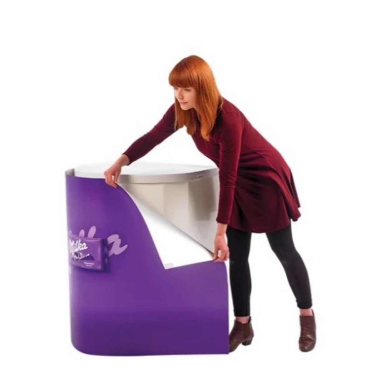 Lady attaching Milka graphic to the Rapido promotional display body panel..jpg