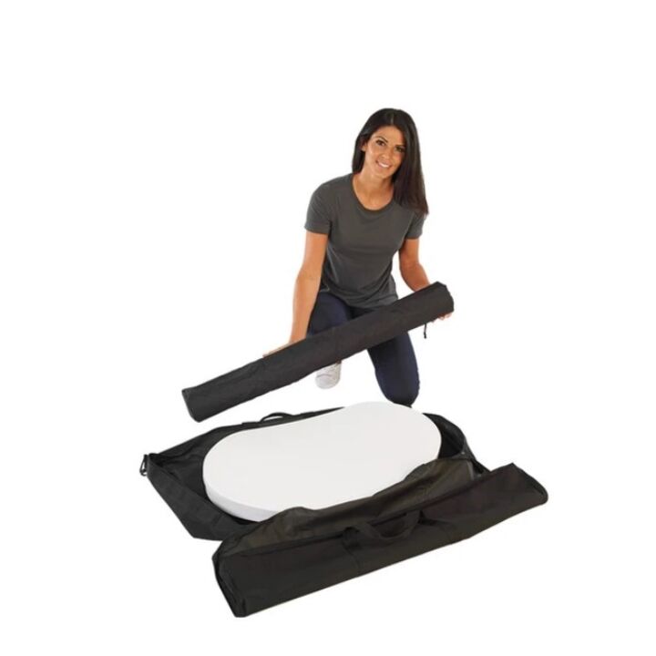 Lady removing the Finesse2 promotional display counter parts from the carry bag.jpg