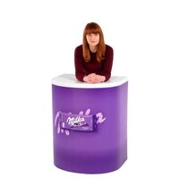 lady standing behind Branded Rapido Demonstration counter no header.jpg