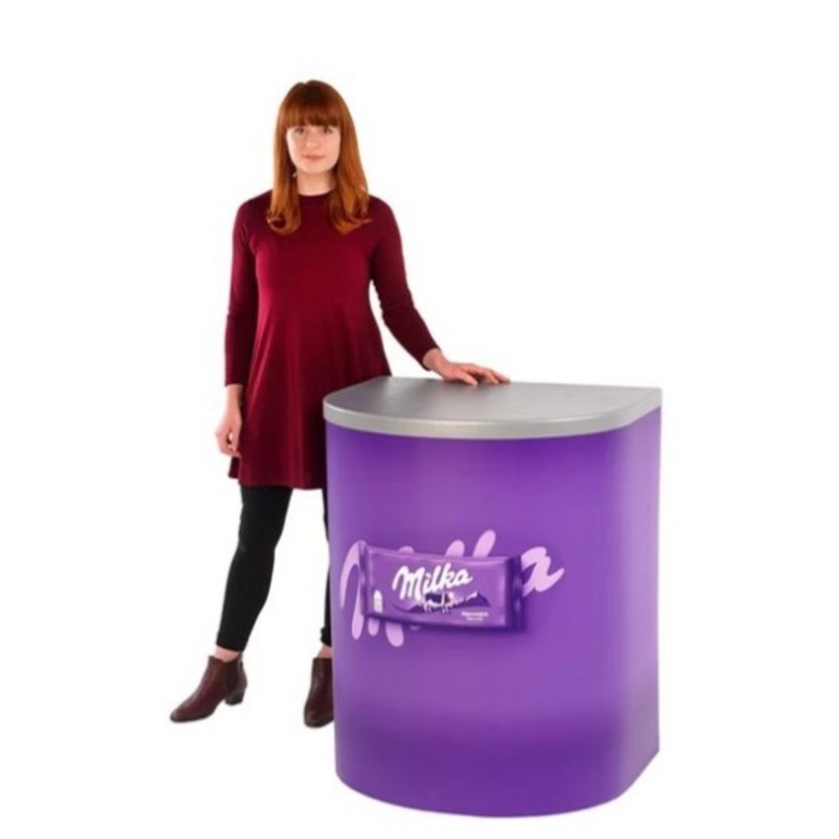 lady standing next to Branded Rapido Demonstration counter no header.jpg