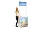 Lady standing next to completed Demo Center promotional display counter.1.jpg