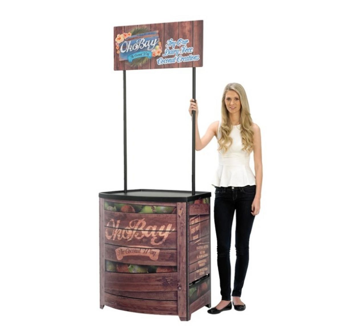 Lady standing next to completed Demo Center promotional display counter..jpg