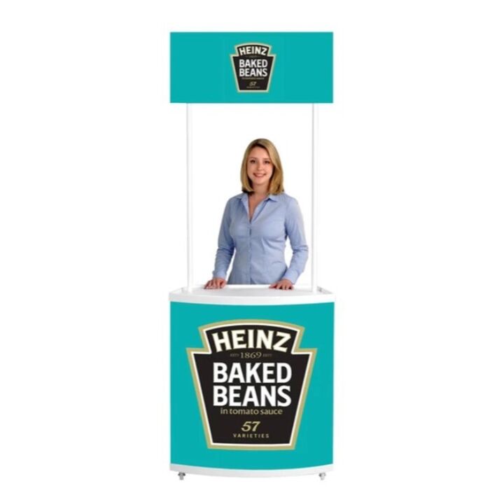 Lady standing next to completed Motion promotional display counter with wheels..jpg