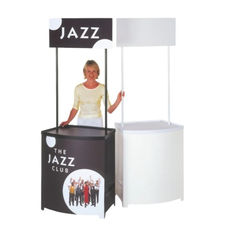 lady standing next to the branded and unbranded Demo Center promotional display counters..jpg