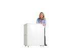 Lady standing next to the Motion promotional display counter with wheels..jpg