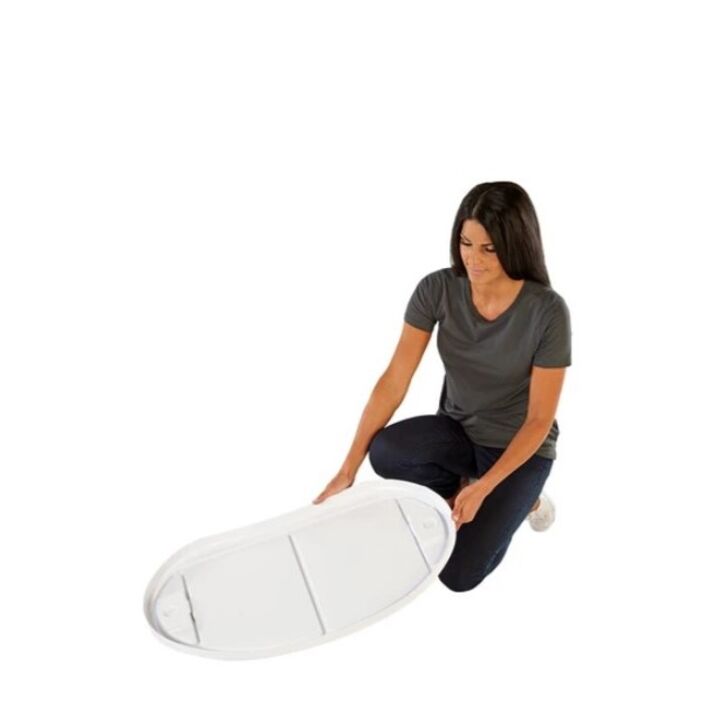 Lady starting the Finesse2 assembly process with the bottom of the promotional display counter.jpg