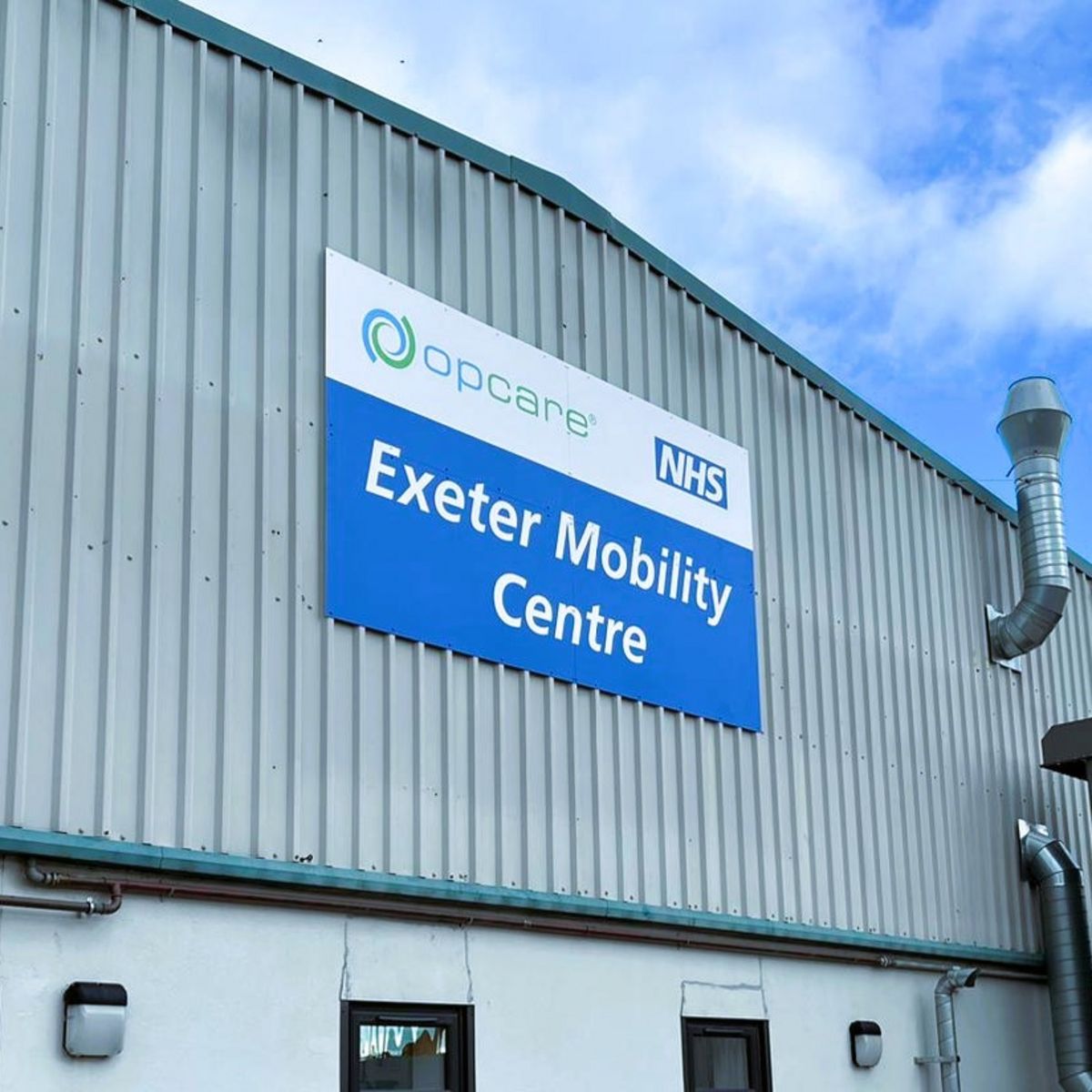 Large Printed Aluminium Sign Panel for Exeter Mobility Centre Mounted on External Building Wall. Size 3660 x 2000mm Landscape..jpg