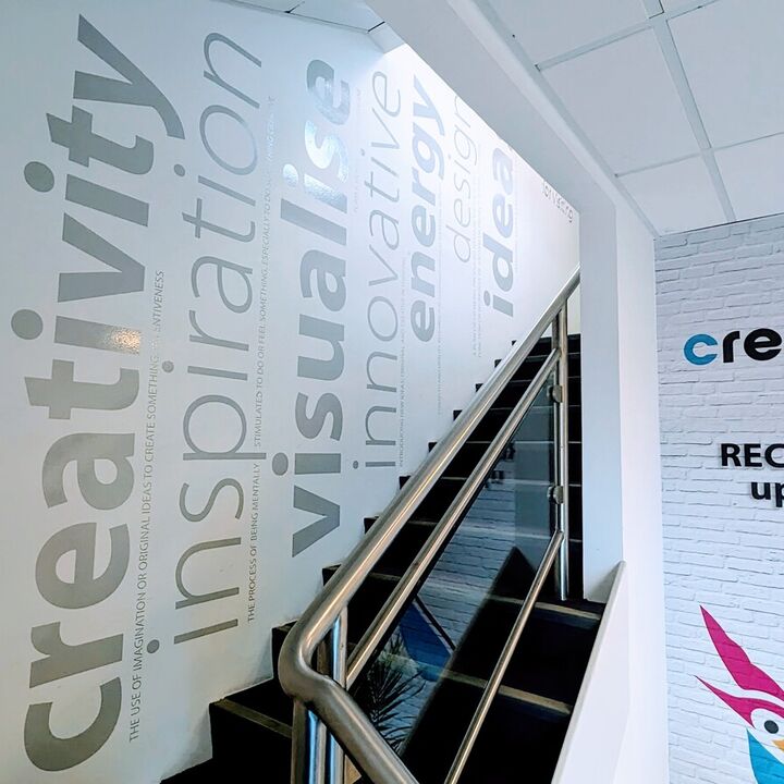 Light Grey Cut Vinyl Gloss Finish Wall Graphics Leading Up Stairs At Creative Solutions.jpg