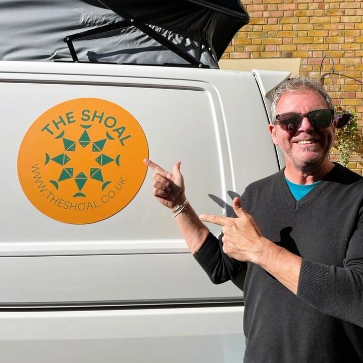 Printed Magnetic Sheet - Brand Logo On Yellow Background Magnetically Stuck to Van.jpg