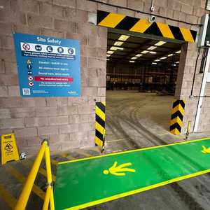 Printed Vinyl Walkway in Operations Area, Safety Wall Signage and Chevron Marking Doorway Printed Vinyl Walkway in Operations Area, Safety Wall Signage and Chevron Marking Doorway