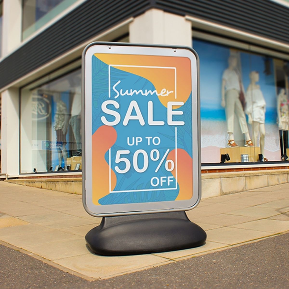 Sentinel outside clothes store showing sale artwork (1).jpg