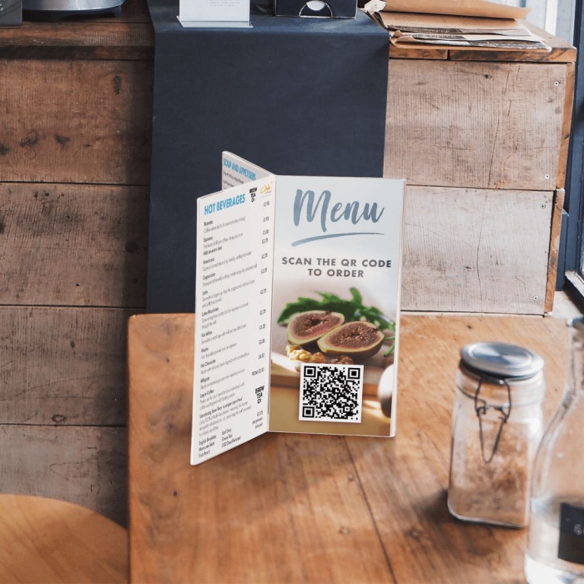 Six Sided Menu Holder placed on a café table.png