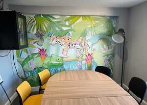 Jungle-themed custom printed wallpaper in meeting room