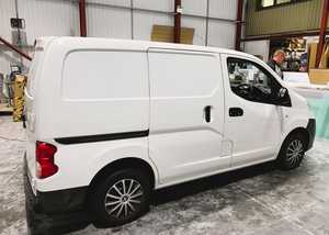 Before - White Nissan NV200 Van White Nissan NV200 Ready for Vehicle Branding Graphics