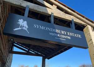Custom created suspended heavy duty handing sign attached to wooden beam Custom created suspended heavy duty handing sign attached to wooden beam