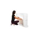 Lady adding the storage shelf to the Finesse promotional display counter..jpg