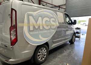 Applying Vinyl branding overlays to silver ford transit van