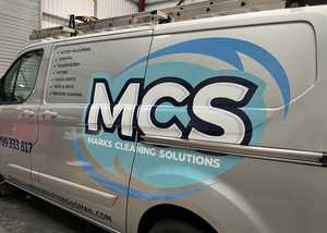 Passenger Side View of Silver Ford Transit With Branding Graphics Applied