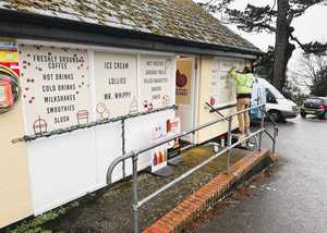 Installing Custom Printed Window Vinyls for Holmbush Cafe in Lyme Regis Installing Custom Printed Window Vinyls for Holmbush Cafe in Lyme Regis