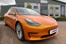 Orange Vinyl Wrap for Tesla Model 3 - Front Profile Orange Vinyl Wrap for Tesla Model 3 - Front Profile