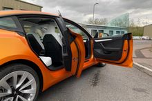 Orange Vinyl Wrap for Tesla Model 3 - Door Shut Internal Vinyl Application Orange Vinyl Wrap for Tesla Model 3 - Door Shut Internal Vinyl Application