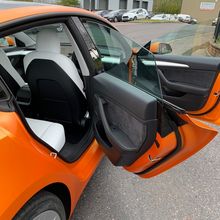 Orange Vinyl Wrap for Tesla Model 3 - Door Shut Internal Vinyl Application Orange Vinyl Wrap for Tesla Model 3 - Door Shut Internal Vinyl Application
