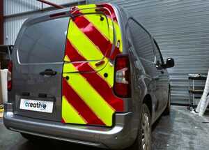 Applying chevron kit to rear doors of a Vauxhall Combo E - Retro-Reflective Red and Non-Reflective Yellow Vehicle Graphics
