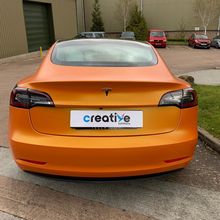 Orange Vinyl Wrap for Tesla Model 3 - Rear Profile Orange Vinyl Wrap for Tesla Model 3 - Rear Profile