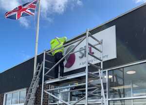 Fixing New Business Tray Sign above entrance