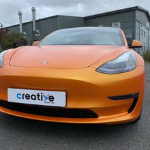 Orange Vinyl Wrap for Tesla Model 3 - Front Profile Orange Vinyl Wrap for Tesla Model 3 - Front Profile