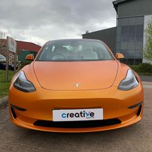 Orange Vinyl Wrap for Tesla Model 3 - Front Profile Orange Vinyl Wrap for Tesla Model 3 - Front Profile