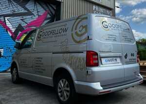 Close Up Branding Graphics on Silver Van