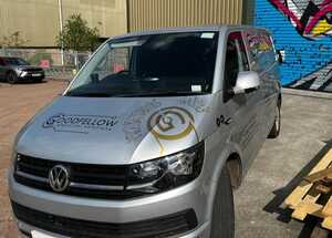 Passenger Side View of Silver Ford Transit With Branding Graphics Applied Passenger Side View of Silver Ford Transit With Branding Graphics Applied