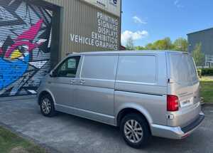 Rear View of Silver Ford Transit With Branding Graphics Applied