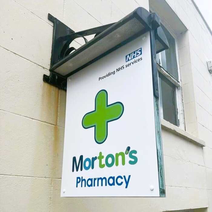 External Fascia Panel and new Projecting Hanging Sign for Morton's Pharmacy in Chard