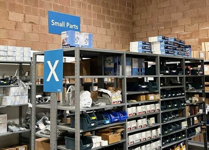 ACM Wall Mounted Signage in Production Area and Warehouse Racking Lettering Signage