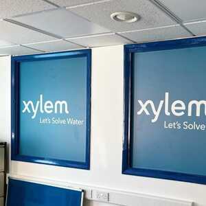 Custom Printed Window Graphics For Production Area Branded With Xylem Water Logo