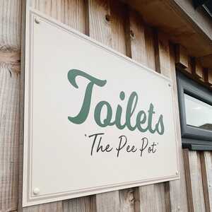 Toliet Direction Signage for Millers Farm Shop - ACM Panel Sign Fixed To Wooden Slat Wall