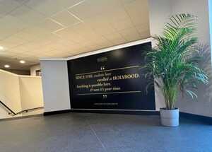 Black ACM Display Panel With Gold Vinyl Text Applied At Top Of School Staircase - Holyrood Academy