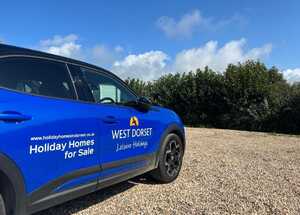 Vehicle Branding Graphics on Blue Vauxhall Mokka for West Dorset Leisure Holidays