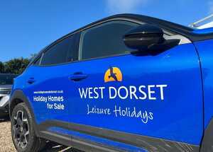 Vehicle Branding Graphics on Blue Vauxhall Mokka for West Dorset Leisure Holidays