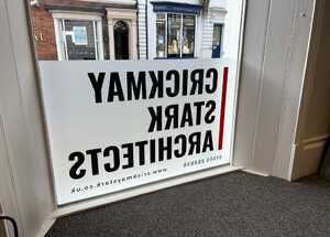 Crickmay Stark Architects Cut Vinyl Window Frosting With Logo - Flood Silver Etch Layer With Logo Cut Out & Infiilled With Dark Grey & Red Stripe - Back View Crickmay Stark Architects Cut Vinyl Window Frosting With Logo - Flood Silver Etch Layer With Logo Cut Out & Infiilled With Dark Grey & Red Stripe - Back View