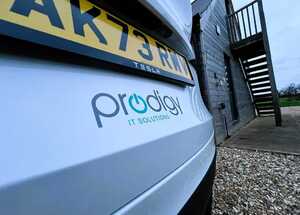 Prodigy IT Solutions Vehicle Branding Graphics Under Rear License Plate- Tesla Model Y Prodigy IT Solutions Vehicle Branding Graphics Under Rear License Plate- Tesla Model Y