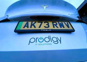 Prodigy IT Solutions Vehicle Branding Graphics Rear View Close-Up - Tesla Model Y.jpg Prodigy IT Solutions Vehicle Branding Graphics Rear View Close-Up - Tesla Model Y.jpg