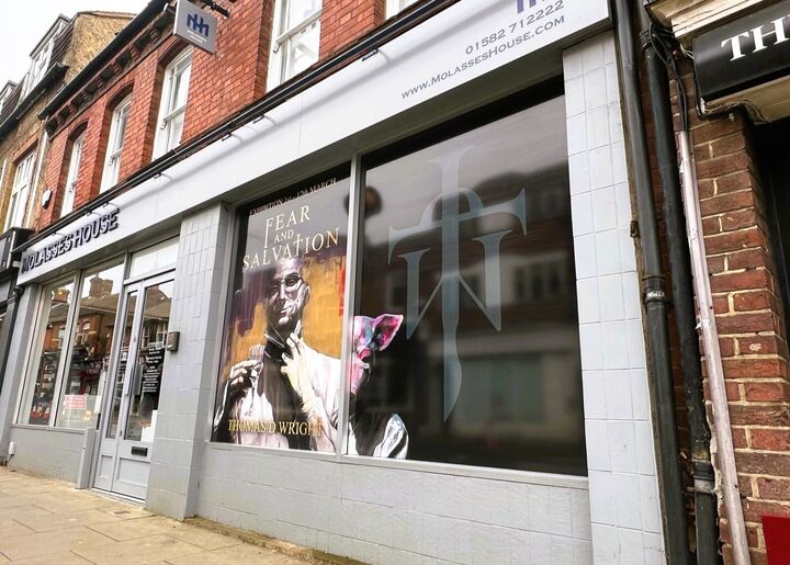 Advertisment Printed Window Graphics for Molasses House.jpg