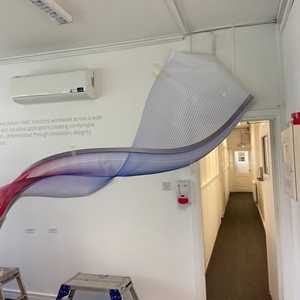 Vinyl tacked to wall before commencing