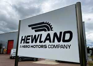 Tailor-made fabricated plaza-style post-mounted tray sign for Hewland Engineering Tailor-made fabricated plaza-style post-mounted tray sign for Hewland Engineering