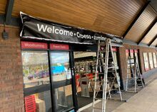 Illuminated Flex Face Signage - Banner being installed into tray.jpg Illuminated Flex Face Signage - Banner being installed into tray.jpg