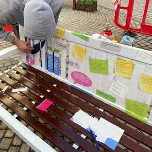 Exeter - Applying Vinyl to struts of the bench